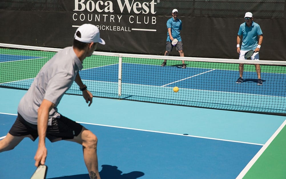 Members playing on Boca West Pickleball court